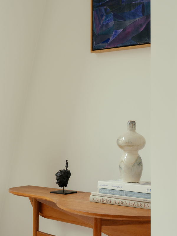 On the second floor, the Butterfly Table has found its place in a small nook alongside a few art books and Cathrine's own sculptures.