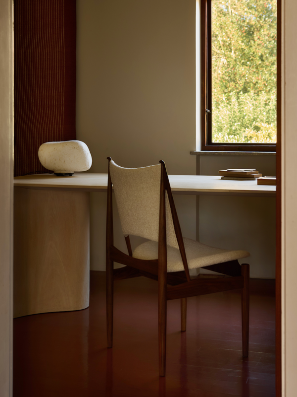 The Egyptian Chair in walnut with 'Moss' upholstery in the colour '0004'.