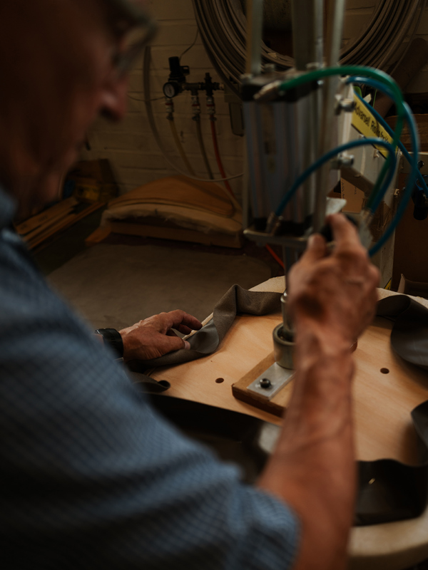 Craftsmanship in focus. Egon in the process of upholstering a seat.