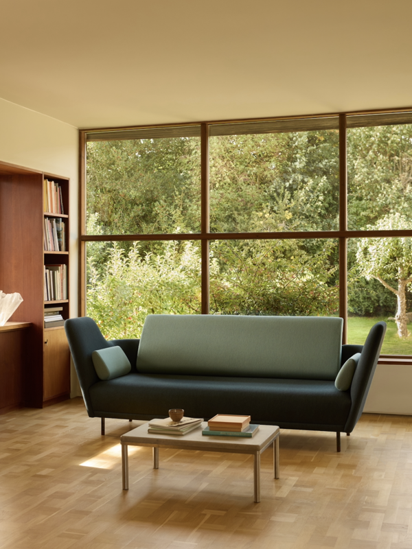 The 57 Sofa with 'Watercolour' upholstery in the colour 'Dark Conifer' on the body and the colour 'Himalaya' on the back and cushions.