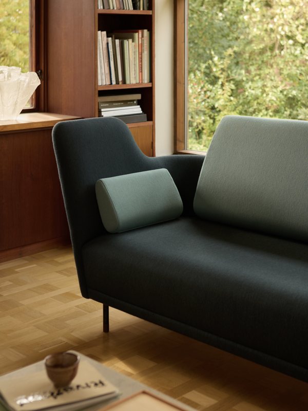 The 57 Sofa with 'Watercolour' upholstery in the colour 'Dark Conifer' on the body and the colour ''Himalaya'' on the back and cushions.