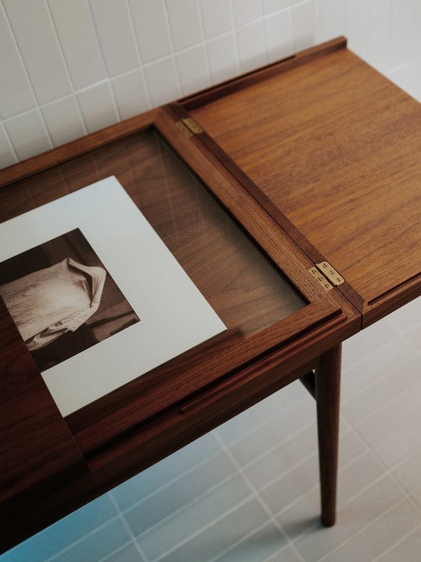 The Art Collector's Table in walnut with the tabletop half open.