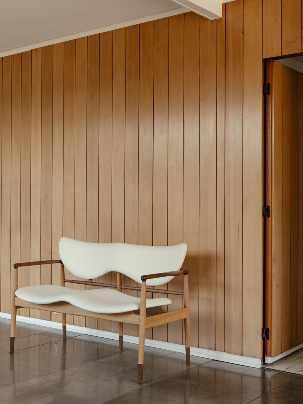 The 48 Sofa Bench in walnut and oak upholstered with Fuse in the colour '0111'.