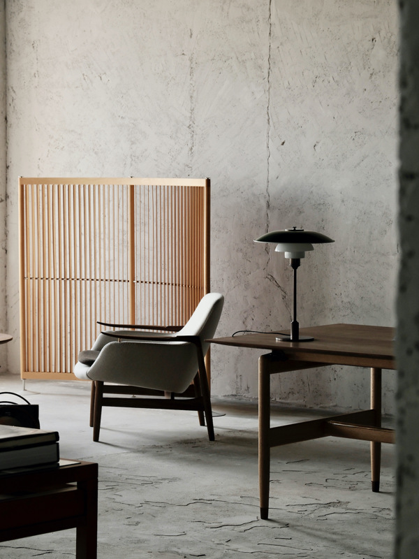 The Kaufmann Table in oak and walnut paired with The 53 Chair in walnut with 'Blans' upholstery in the colour '01-100' with a cushion in the colour '01-161'.