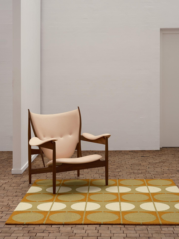 The Circle Rug in the colour 'Orange/Green'.