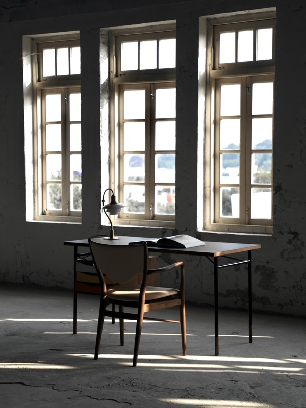 The 46 Armchair in walnut with 'Vegetal' leather upholstery in the colour '90'.