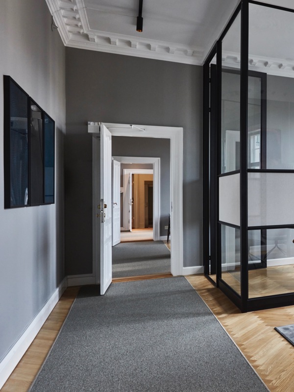 The glass walls have been constructed with a refined degree of detail, that integrate with the architecture of the rooms.