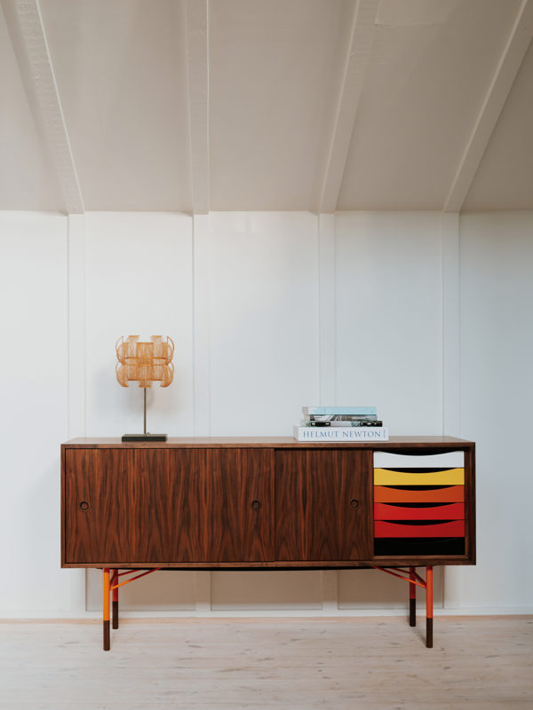 The Sideboard in walnut with trays in the warm color scheme.