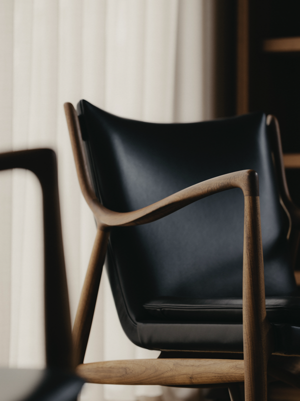 The 45 Chair in walnut with 'Elegance' leather in the color 'Black'. Photo credit: The Monocot Shop / JUST BUILD LTD / Studio Periphery