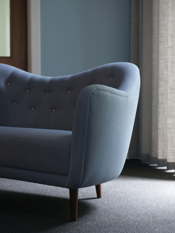 The 46 Sofa with walnut legs and 'Rime' upholstery in the colour '721'.