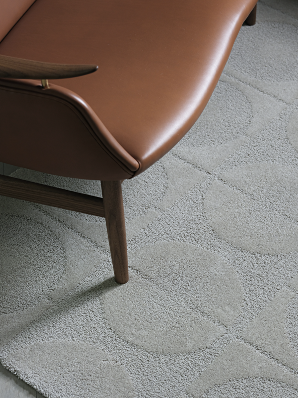 The 53 Sofa in walnut with 'Vegetal' leather upholstery in the colour '95'.