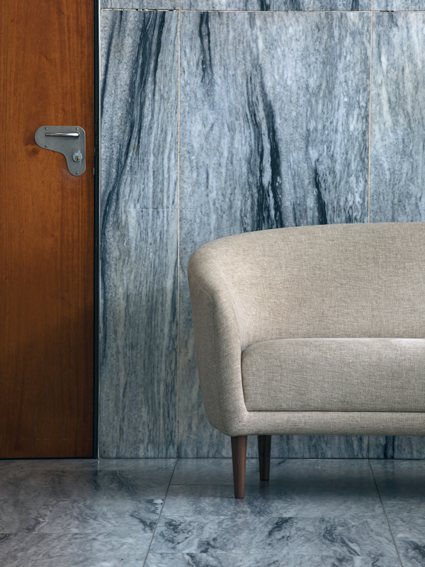 The Little Mother Sofa with walnut legs and 'Clay' upholstery in the colour '011'.