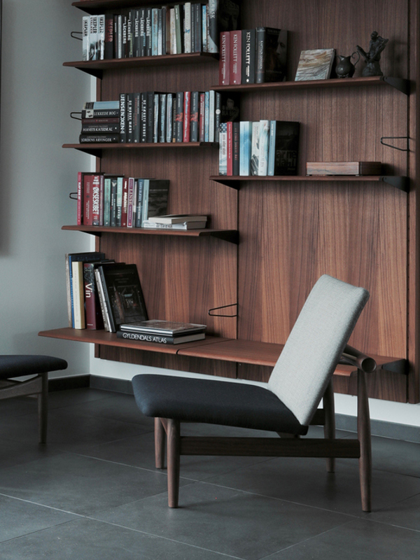 Two panels in walnut with shelves in different sizes.