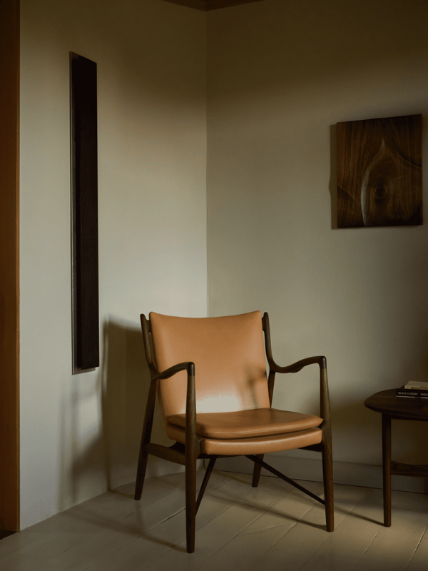 The 45 Chair in walnut with 'Vegetal' leather upholstery. 
