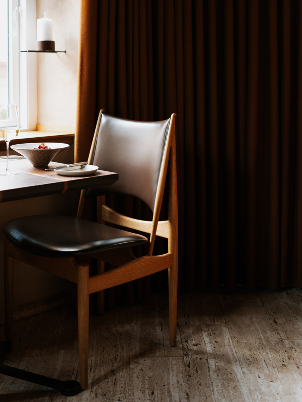 Egyptian Chair in oak upholstered in 'Prestige' leather in the colour 'Coffee'.