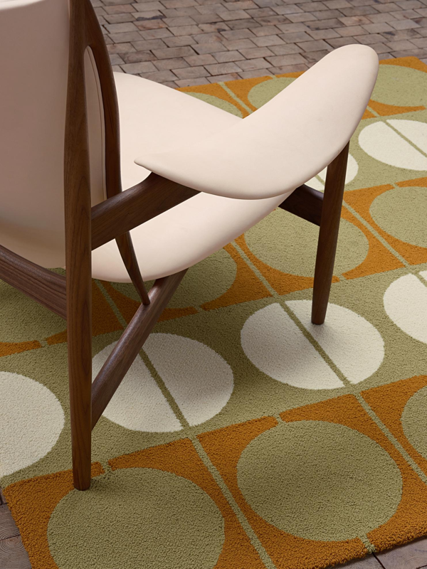The Circle Rug in the colour 'Orange/Green'.